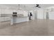 Open concept kitchen and living area with tile floors at 17825 Gawthrop Dr # 104, Bradenton, FL 34211