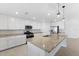 Modern kitchen with granite countertops and island at 17825 Gawthrop Dr # 104, Bradenton, FL 34211
