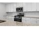 Modern kitchen features stainless steel appliances and granite countertops at 17825 Gawthrop Dr # 104, Bradenton, FL 34211