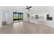 Open floor plan with kitchen island and access to patio at 17825 Gawthrop Dr # 104, Bradenton, FL 34211