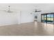 Bright and spacious living room with tile floors and access to a view at 17825 Gawthrop Dr # 104, Bradenton, FL 34211