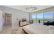 Main bedroom with stunning water views and private balcony access at 1800 Benjamin Franklin Dr # A1003, Sarasota, FL 34236