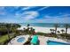 An aerial view of the pool and beach with stunning ocean views at 1800 Benjamin Franklin Dr # A405, Sarasota, FL 34236