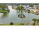 Community overview showcasing waterfront property and lush landscape at 2271 Sandlewood Dr, Venice, FL 34293