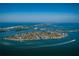Aerial view of waterfront homes on a tropical island at 235 Grant Dr, Sarasota, FL 34236