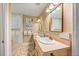 Bathroom with double vanity and large mirror at 235 Grant Dr, Sarasota, FL 34236