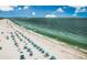 Beach with rows of umbrellas and lounge chairs at 235 Grant Dr, Sarasota, FL 34236