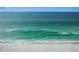 Person walking on a tranquil beach at 235 Grant Dr, Sarasota, FL 34236
