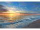 Scenic beach sunset with gentle waves lapping the shore at 235 Grant Dr, Sarasota, FL 34236