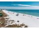 Beach scene with people relaxing on the sand at 235 Grant Dr, Sarasota, FL 34236