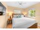 Bedroom with a wooden bed frame and flat screen TV at 235 Grant Dr, Sarasota, FL 34236
