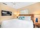 Bedroom with a wooden bed frame and flat screen TV at 235 Grant Dr, Sarasota, FL 34236