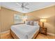 Bedroom with wooden bed frame and ceiling fan at 235 Grant Dr, Sarasota, FL 34236