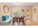 Breakfast nook with built-in bench seating, wood table, and access to backyard at 235 Grant Dr, Sarasota, FL 34236