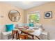 Charming breakfast nook with built-in bench seating and a wood table at 235 Grant Dr, Sarasota, FL 34236