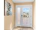 Inviting entryway with tiled floor and glass door at 235 Grant Dr, Sarasota, FL 34236