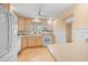 Bright kitchen features light wood cabinets, ample counter space, and modern appliances at 235 Grant Dr, Sarasota, FL 34236
