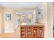 Kitchen features an island and orange cabinets at 235 Grant Dr, Sarasota, FL 34236