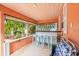 Covered lanai with a bar and four light blue stools at 235 Grant Dr, Sarasota, FL 34236