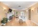 Light and airy living room with hardwood floors and a fireplace at 235 Grant Dr, Sarasota, FL 34236