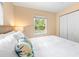 Main bedroom with king-size bed and view of the pool at 235 Grant Dr, Sarasota, FL 34236