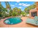 Relaxing kidney-shaped pool with lounge chairs at 235 Grant Dr, Sarasota, FL 34236