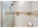 Large walk-in shower with mosaic tile accents at 235 Grant Dr, Sarasota, FL 34236