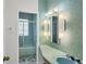 Bathroom with teal pebble tile and a large vanity at 2605 Desoto Rd, Sarasota, FL 34234