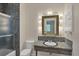 Bathroom boasts granite countertop, sink and shower at 2605 Desoto Rd, Sarasota, FL 34234