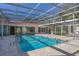 Inviting swimming pool with a screened enclosure at 2605 Desoto Rd, Sarasota, FL 34234