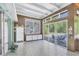 Sunroom with tiled floor and glass walls overlooking pool at 2605 Desoto Rd, Sarasota, FL 34234