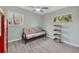 Small bedroom with futon and shelving unit at 2839 Swifton Dr # 19, Sarasota, FL 34231