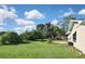 Large backyard with grassy area and trees at 3111 Taunton W Dr, Bradenton, FL 34205