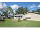 Large backyard with patio and grassy area at 3111 Taunton W Dr, Bradenton, FL 34205