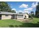 Large backyard with patio and grassy area at 3111 Taunton W Dr, Bradenton, FL 34205