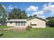 Large backyard with patio and grassy area at 3111 Taunton W Dr, Bradenton, FL 34205