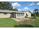 Large backyard with patio and grassy area at 3111 Taunton W Dr, Bradenton, FL 34205