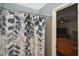 Bathroom with shower/tub combo and view into bedroom at 3111 Taunton W Dr, Bradenton, FL 34205