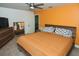 Spacious bedroom with king bed, dresser, and ceiling fan at 3111 Taunton W Dr, Bradenton, FL 34205
