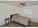 Bright bedroom with double bed, side table, and window blinds at 3111 Taunton W Dr, Bradenton, FL 34205