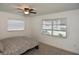 Cozy bedroom with double bed and two windows at 3111 Taunton W Dr, Bradenton, FL 34205
