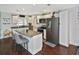 Bright kitchen with white cabinets, granite countertops, and stainless steel appliances at 3111 Taunton W Dr, Bradenton, FL 34205