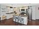 Updated kitchen featuring white cabinets, granite countertops, and stainless steel appliances at 3111 Taunton W Dr, Bradenton, FL 34205