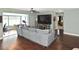 Spacious living room featuring a comfortable couch and large TV at 3111 Taunton W Dr, Bradenton, FL 34205