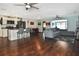 Open concept living room and kitchen with dark hardwood floors at 3111 Taunton W Dr, Bradenton, FL 34205