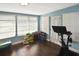 Bright sunroom with multiple windows, a play area, and exercise equipment at 3111 Taunton W Dr, Bradenton, FL 34205