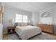 Cozy bedroom with a queen-size bed, nightstands, and a dresser at 3260 Bayou Rd, Longboat Key, FL 34228
