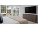 Spacious bedroom with large windows, a dresser, and access to a balcony at 3260 Bayou Rd, Longboat Key, FL 34228