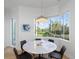 Breakfast nook with water views and a round marble table at 3260 Bayou Rd, Longboat Key, FL 34228