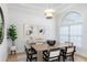 Elegant dining room with wood table and modern art at 3260 Bayou Rd, Longboat Key, FL 34228